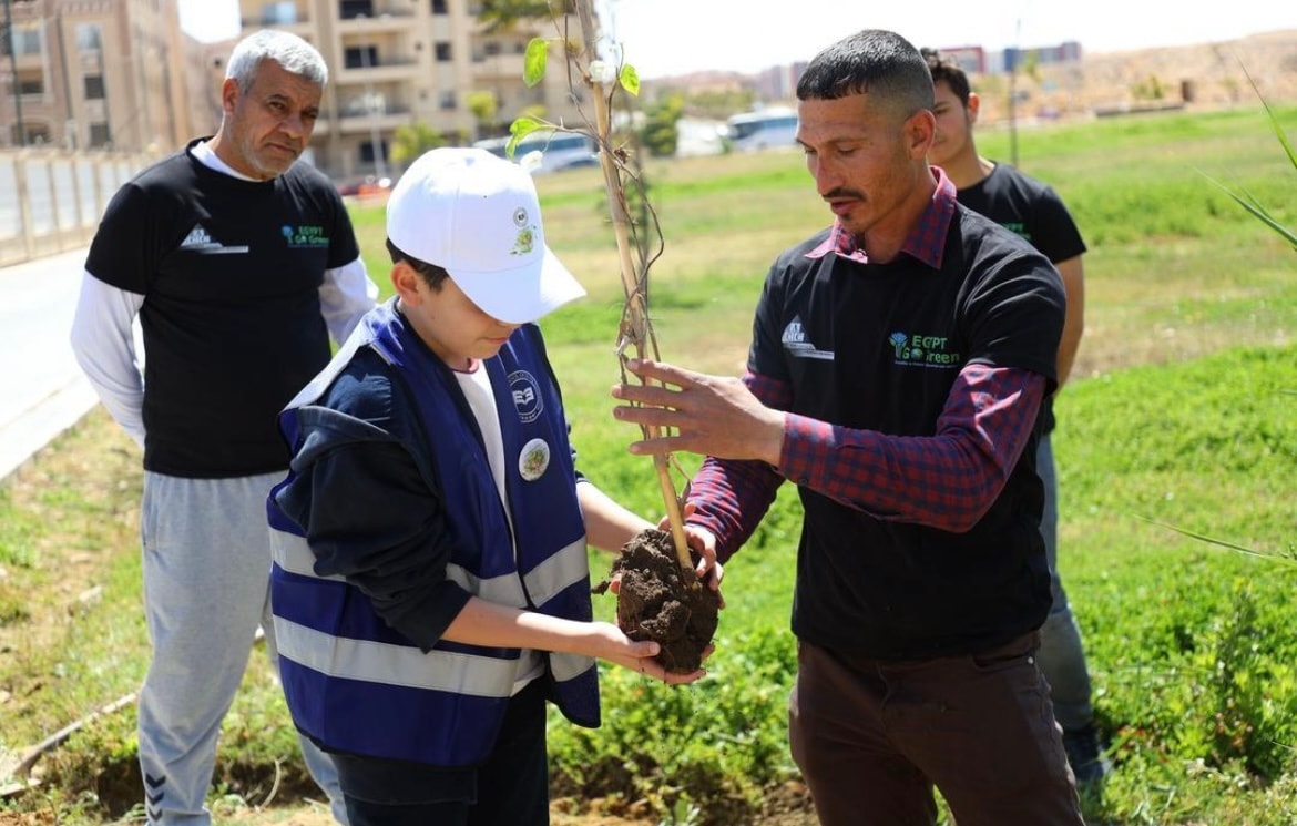 Student receives tree sapling for planting